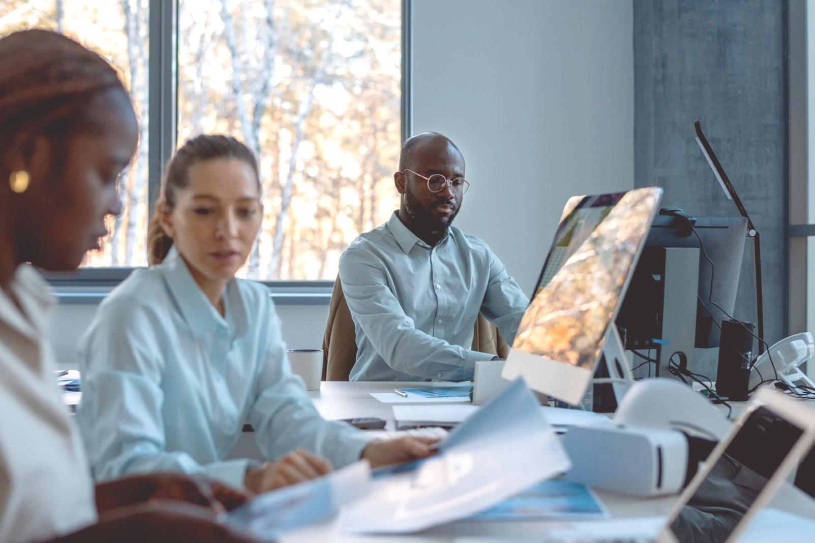 Calculator, receipts, and financial documents arranged on desk for monthly budget review